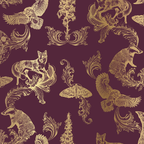 Burgundy and gold woodland wallpaper used as a dramatic feature wall in a warm, elegant interior