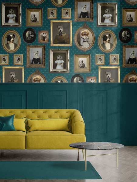 Green dog portrait gallery wallpaper styled above teal panelling with a mustard sofa