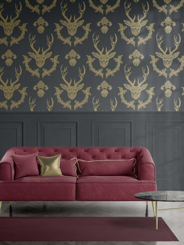 King of the Wood Charcoal stag wallpaper above dark panelling with burgundy sofa and gold accents