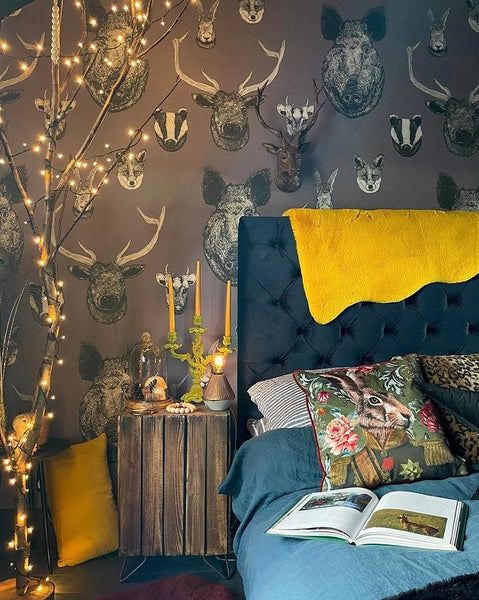 Grey British wildlife wallpaper used in a neutral bedroom or hallway with heritage animal illustrations