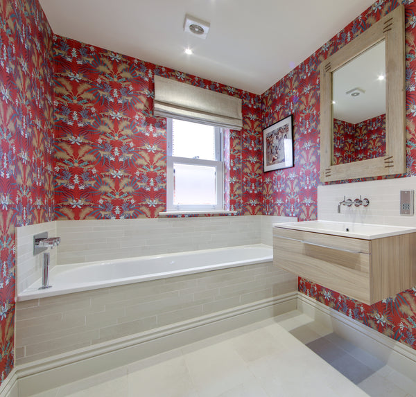 Red Leopard Luxe wallpaper used as a bold statement wall with gold palm details and luxury animal print design